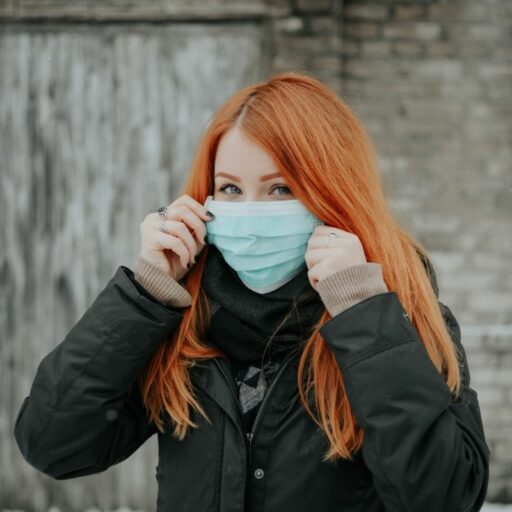 A woman with a coronavirus mask on